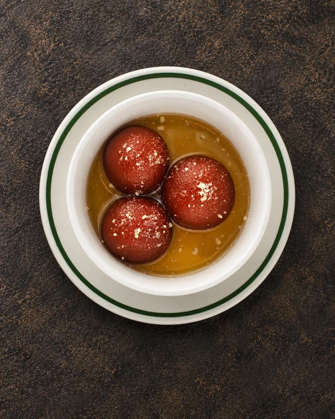Gulab Jamun dumplings soaked in rose flavored syrup